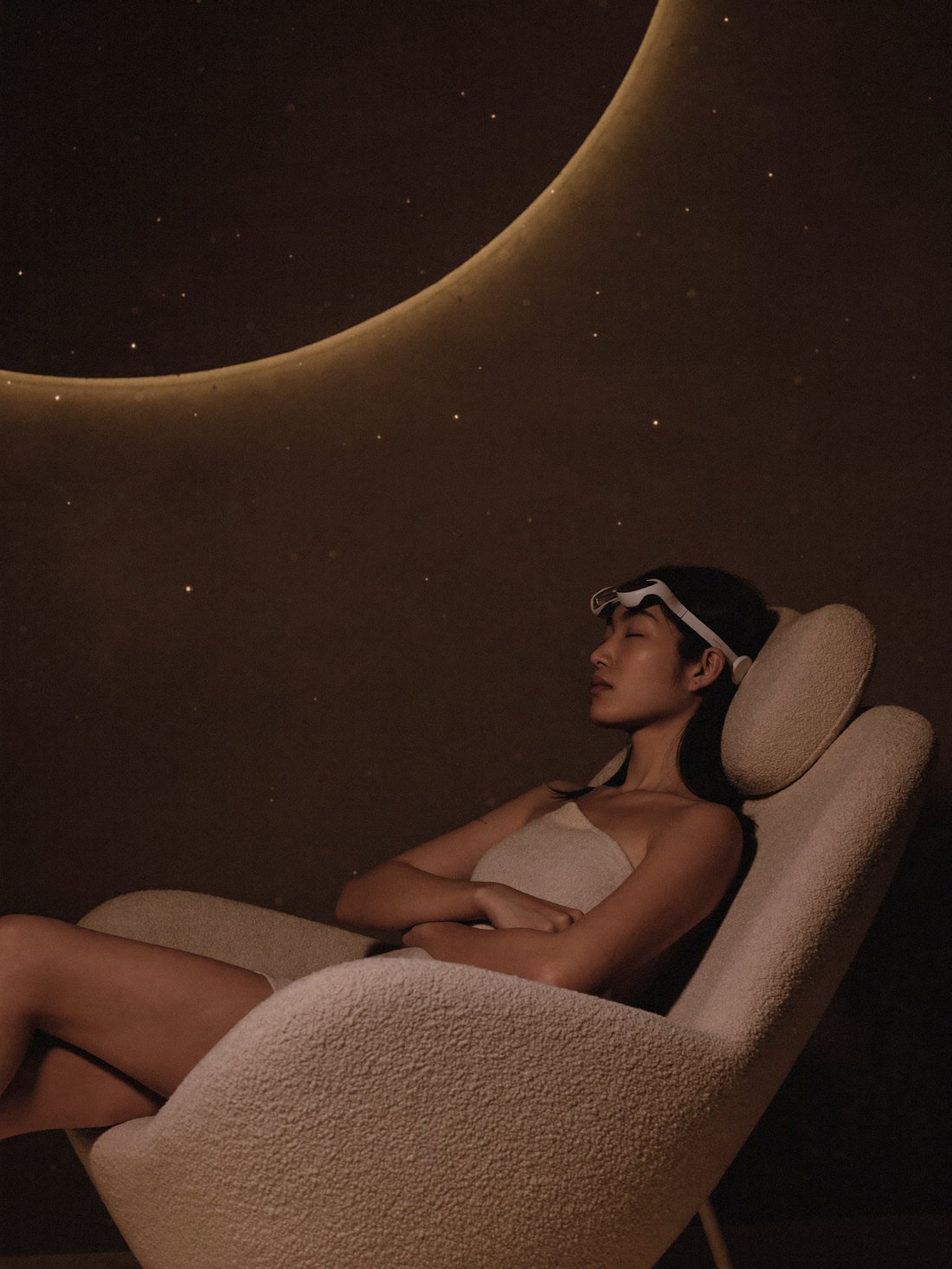 A guest resting in a lounge chair during a quiet neuromodulation session