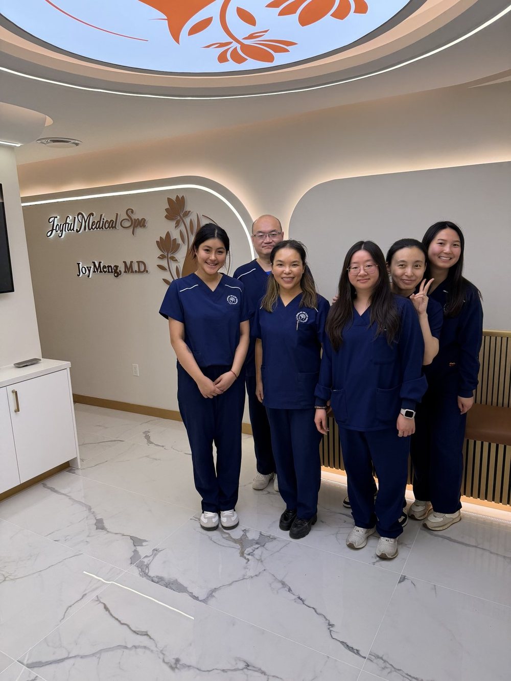 The Joyful team standing in the new lobby